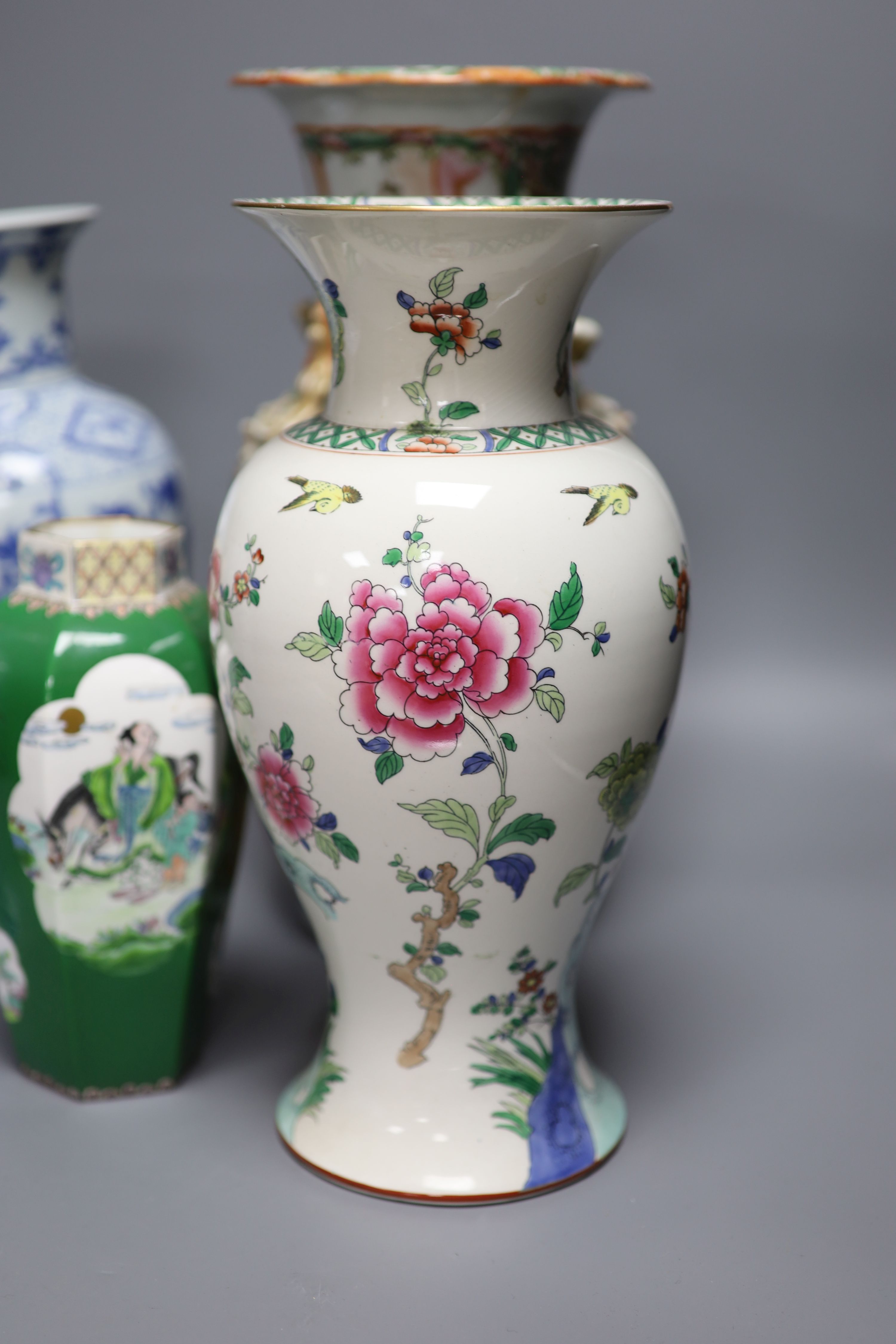 A Chinese famille rose Canton vase, a pair of blue and white vases and two others, tallest 35.5cm